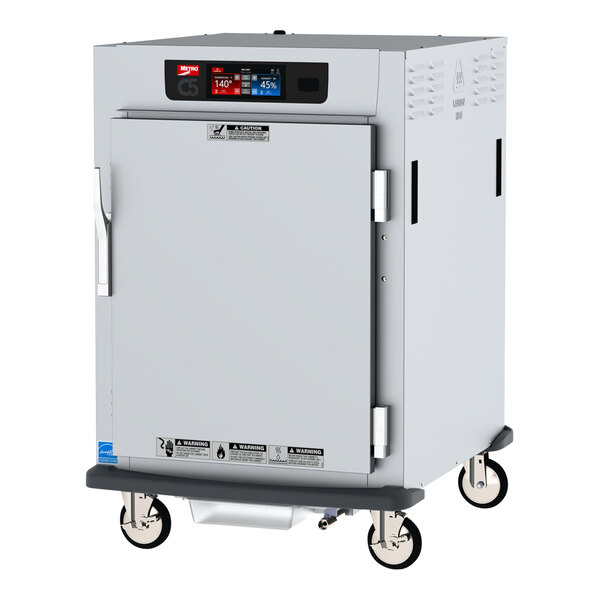 A white Metro C5 heated holding cabinet with a solid door on wheels.