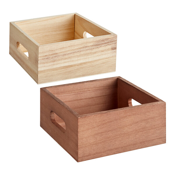 Three wooden crates with handles holding Acopa glass milk bottles with lids.