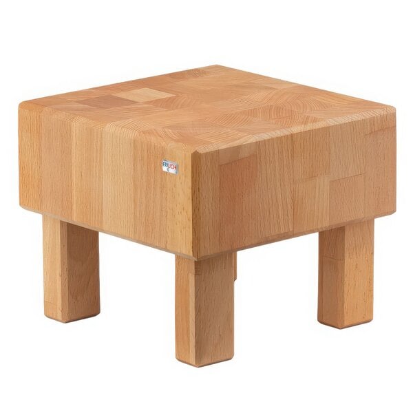 A Frilich beech wood butcher block cube riser on a wooden table with legs.