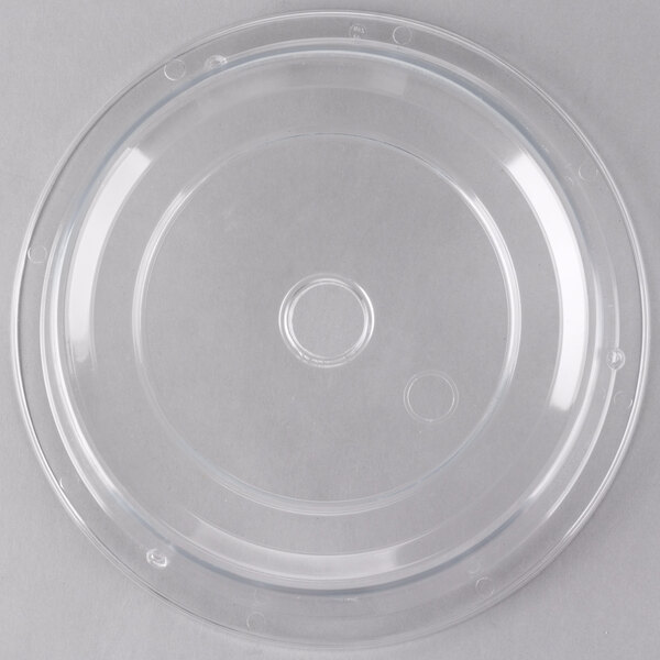 A clear plastic plate cover with a circular top and a hole in the middle.