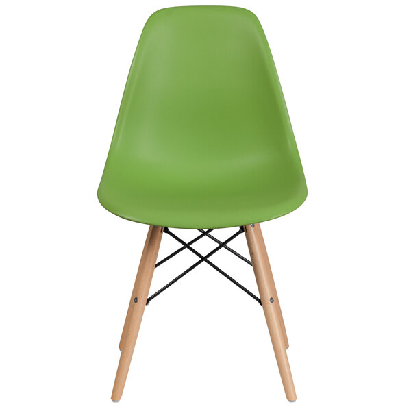 A green Flash Furniture plastic side chair with wooden legs.