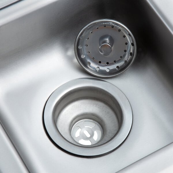 A Regency stainless steel drop-in sink with a drain.