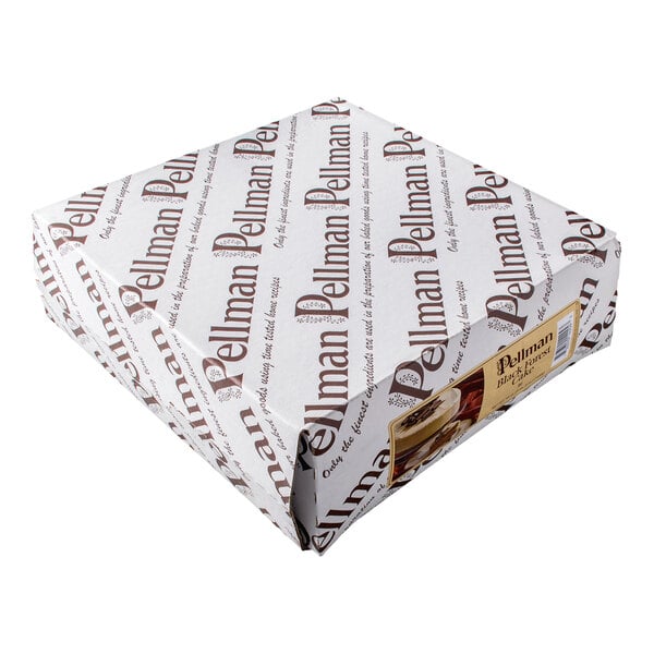A square box wrapped in white paper with the word 'Pellman' printed repeatedly in brown, and a small label with an image of a cake on one side.
