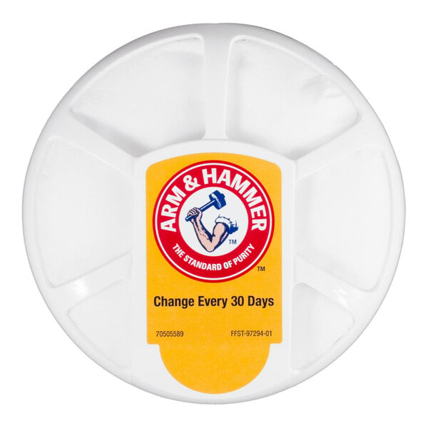 A round white container with a yellow Arm & Hammer label instructing to change every 30 days.