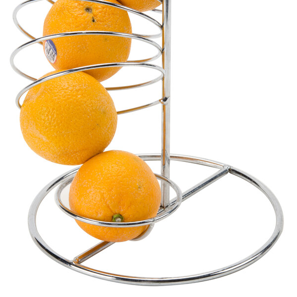 a group of oranges on a metal rack