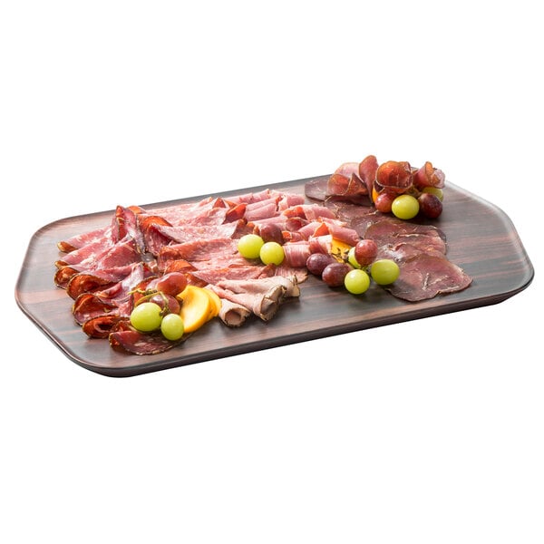 A rectangular Rosseto walnut melamine tray with meat and grapes.