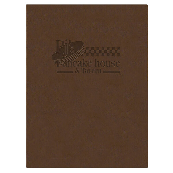 A brown customizable Menu Solutions menu board on a table with a brown menu on it.