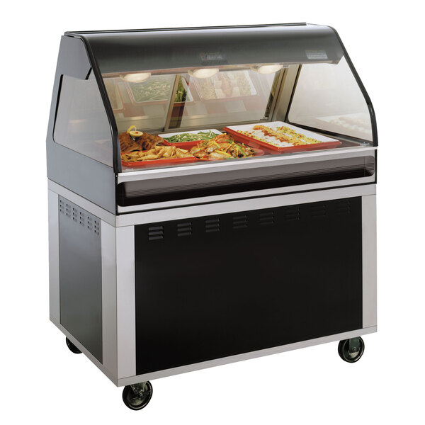 An Alto-Shaam heated display case with a glass door and stainless steel frame on a counter.