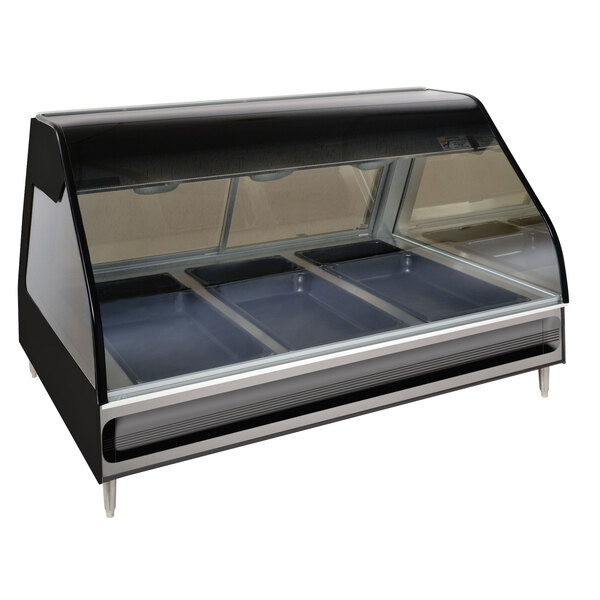 An Alto-Shaam heated display case with three trays inside on a counter.