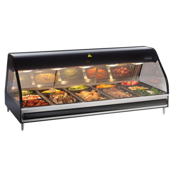 An Alto-Shaam stainless steel heated display case on a counter with food trays inside.