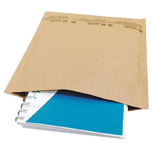 A brown envelope with a blue Universal notebook inside.