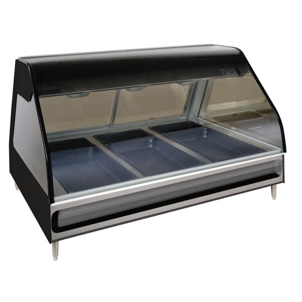 An Alto-Shaam heated display case with three trays inside on a counter.