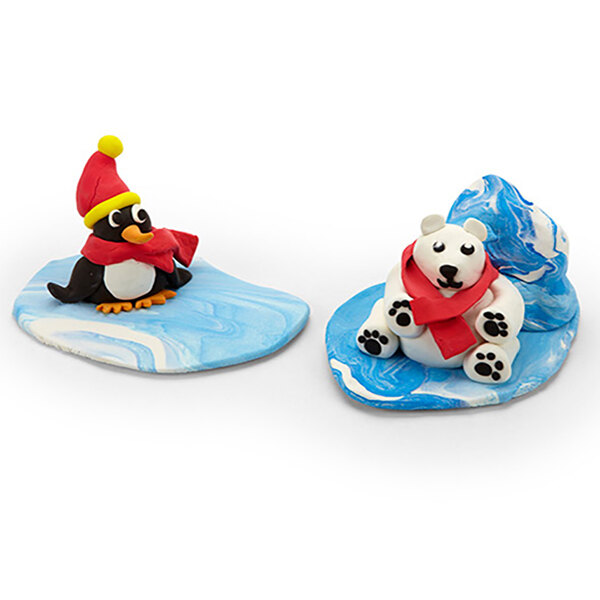 A pair of penguins and a polar bear figurine made from Crayola Model Magic.