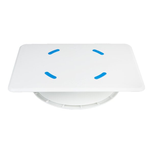 A white rectangular platform with four blue curved grips on top, mounted on a circular rotating base.