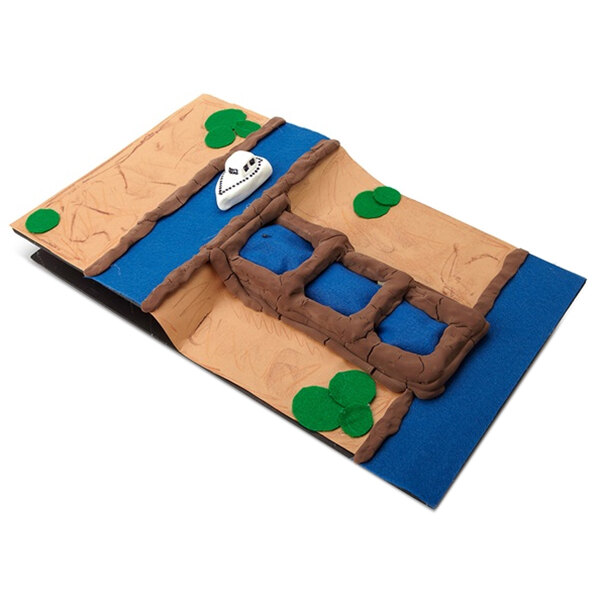 A model of a boat made with Crayola Model Magic on paper.