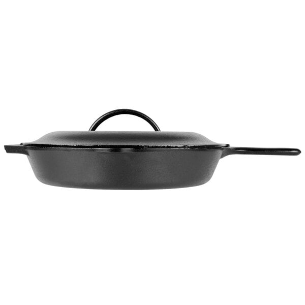 A Lodge black cast iron skillet with a handle and lid.