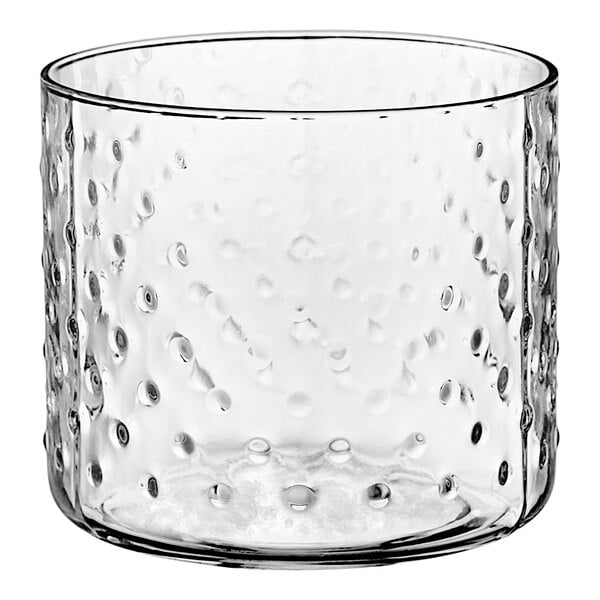 An Acopa hobnail style double rocks glass with a white background.