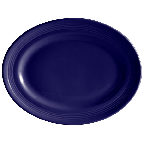 A cobalt blue oval platter with a white center and rim.