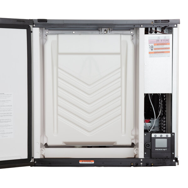 A white rectangular Manitowoc water cooled ice machine with a black door open.