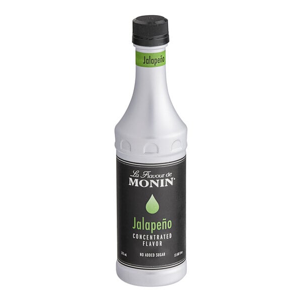 A white Monin bottle with a black label containing jalapeno concentrated flavor.