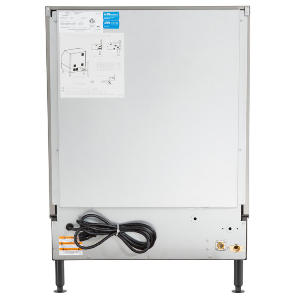 The back of a white Manitowoc NEO undercounter ice machine with a black power cord.