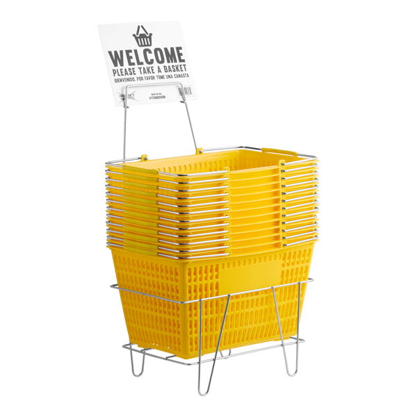 A stack of yellow plastic grocery market shopping baskets with a metal stand and a sign on top.