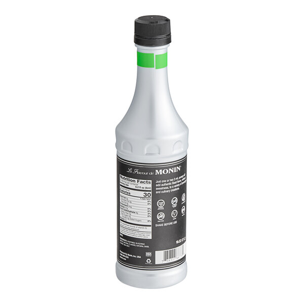 A white bottle of Monin Basil Concentrated Flavor with a black label.
