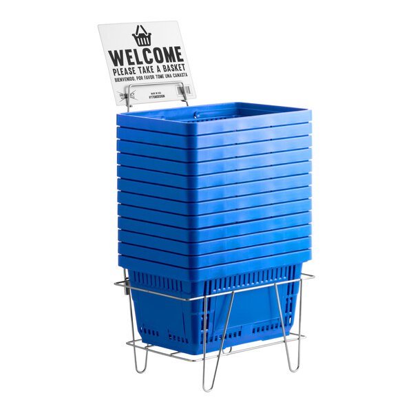 A stack of blue plastic grocery shopping baskets with a metal stand and a welcome sign.