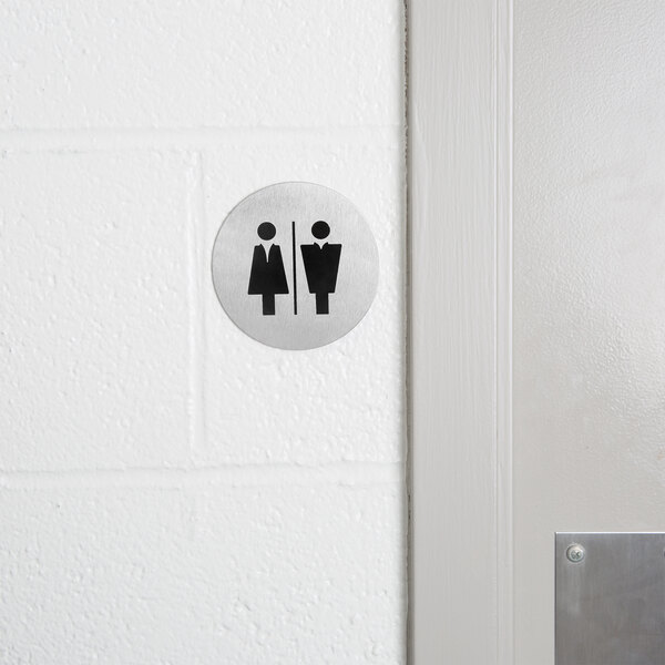 American Metalcraft stainless steel universal signs on a bathroom door.