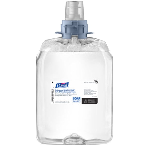 A clear plastic bottle with a blue cap of Purell Healthy Soap Professional foaming hand soap.