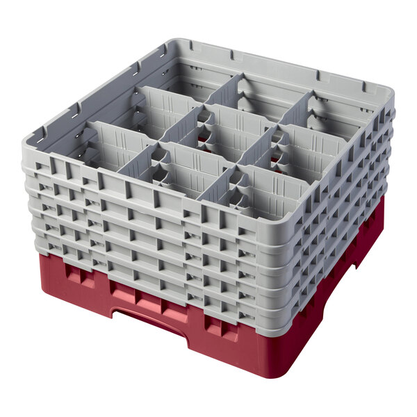 A red and gray Cambro plastic glass rack with compartments and extenders.