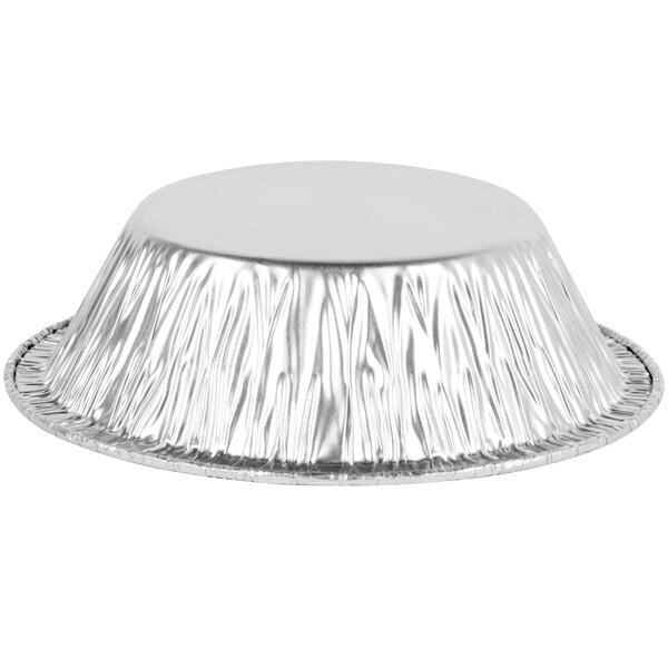 A round silver aluminum foil pan with a round edge.