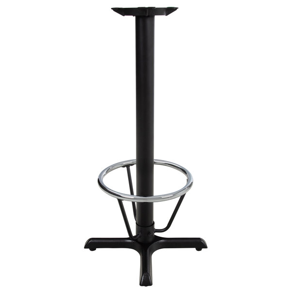 A Lancaster Table & Seating black cast iron bar height table base with a metal foot ring.