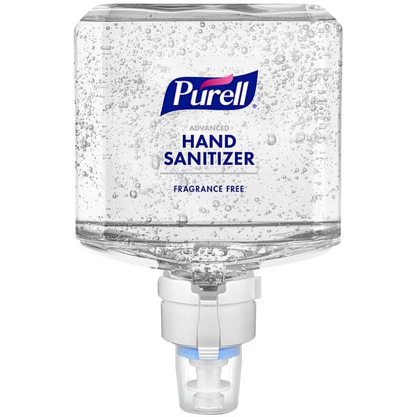 A Purell hand sanitizer dispenser in a hotel room.