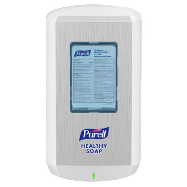 A close-up of a white Purell® automatic soap dispenser with a label.