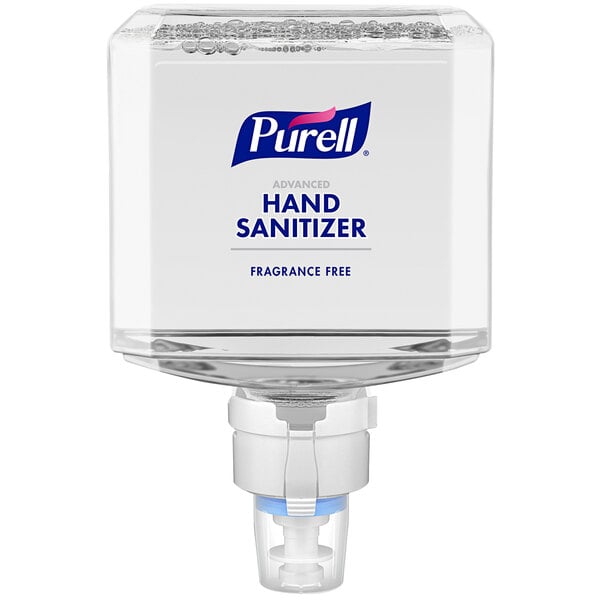 A Purell hand sanitizer dispenser with a white lid.