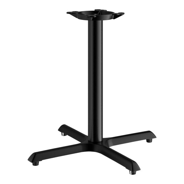 A Lancaster Table & Seating black cast iron table base with four legs.