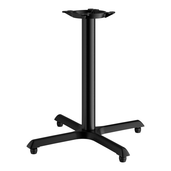 A black Lancaster Table & Seating cast iron table base with four legs.