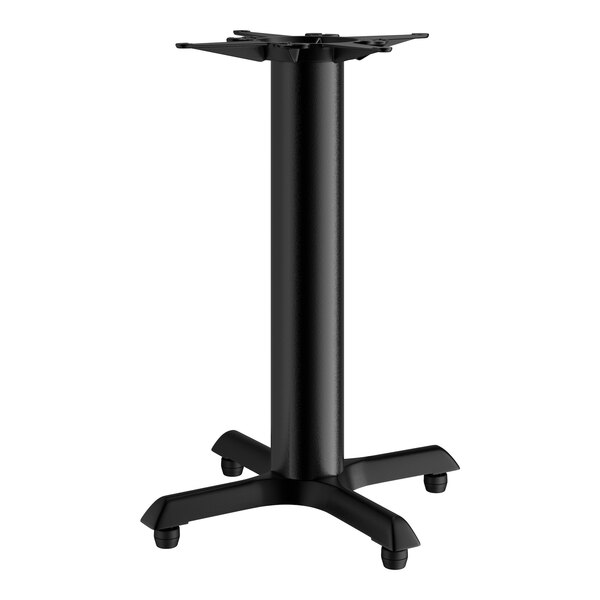 A black Lancaster Table & Seating cast iron table base with four legs.