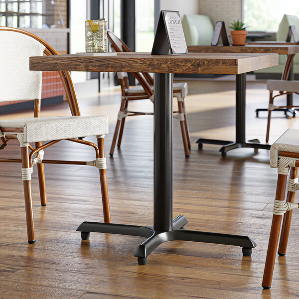 A Lancaster Table with a black standard height column base.