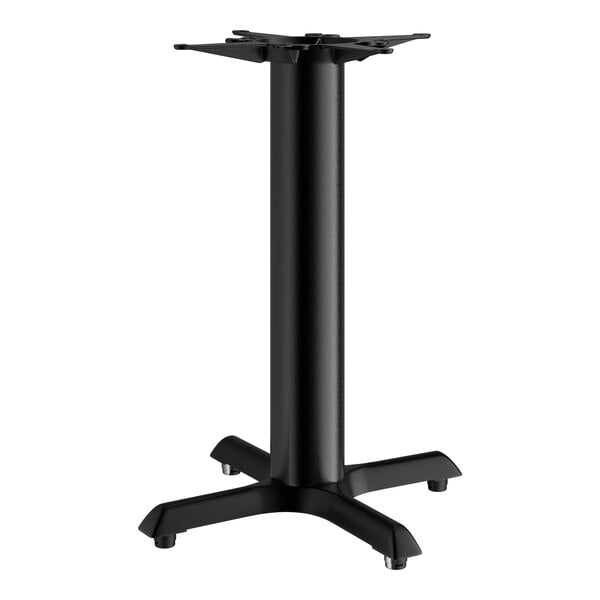 A Lancaster Table & Seating black cast iron table base with four legs.