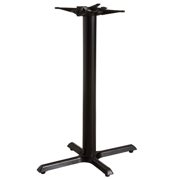 A black Lancaster Table & Seating cast iron bar height table base with a metal pole.