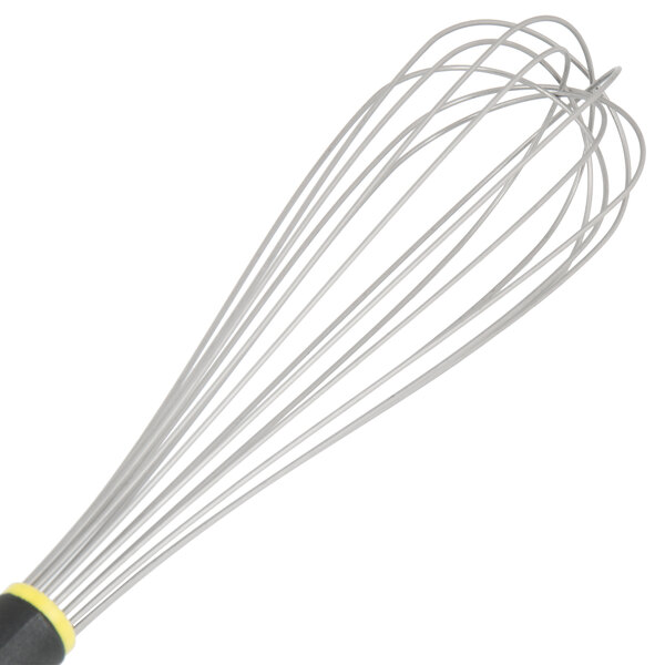A Matfer Bourgeat stainless steel wire whisk with a yellow and black Exoglass handle.