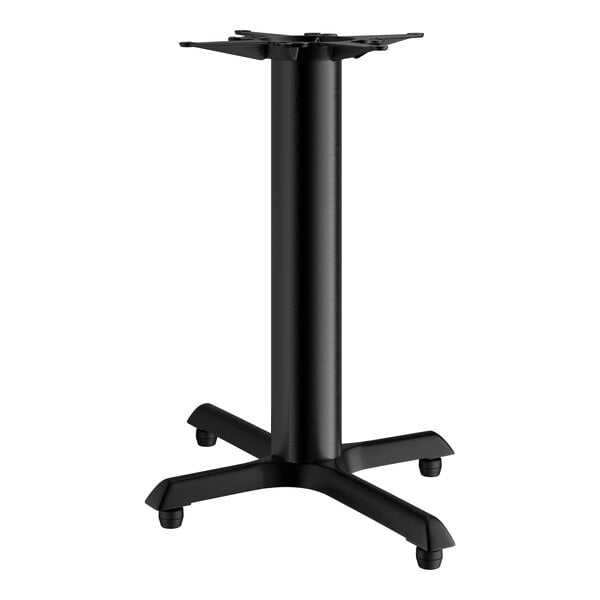 A black Lancaster Table & Seating cast iron table base with four legs.