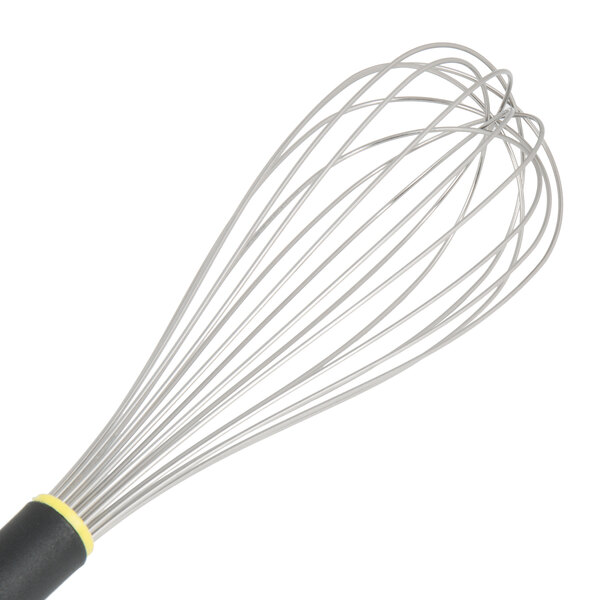 A Matfer Bourgeat stainless steel wire whisk with a yellow Exoglass handle.