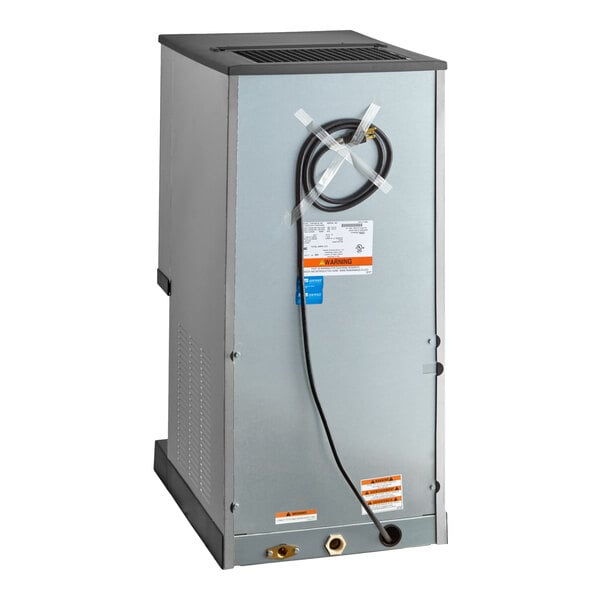 A stainless steel countertop nugget ice maker and dispenser with a sensor dispensing feature.