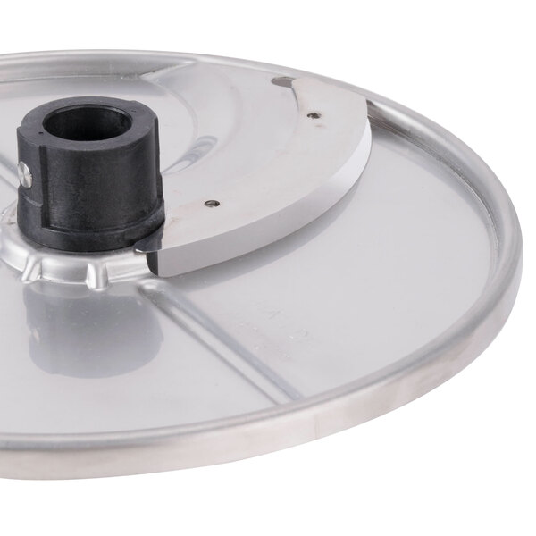 A circular metal plate with a black plastic handle.