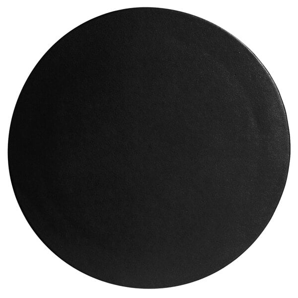 A black G.E.T. Enterprises Bugambilia medium round disc on a table.