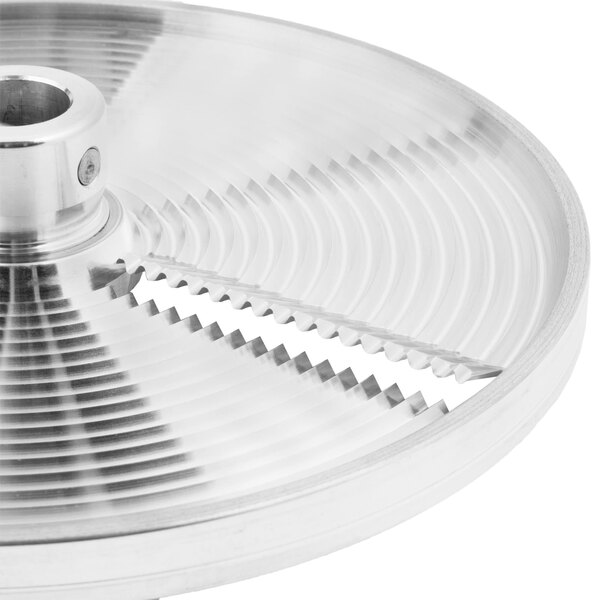 A silver Berkel crimping plate with a circular metal blade.