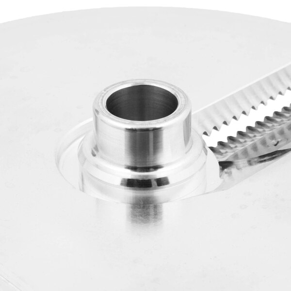 A Berkel crimping plate with knife, a circular metal object with a blade.